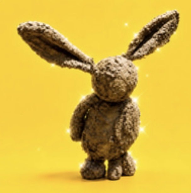 A 3D-rendered gray textured bunny figurine with large ears, a bow tie, and sparkle effects, standing against a bright yellow background.