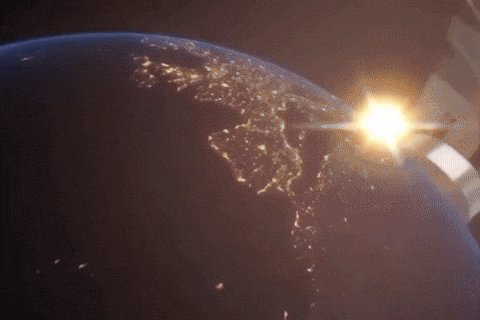 The image shows a view of Earth from space, with the sun setting behind the planet. The scene includes a city skyline visible below the earth's surface. In the corner of the image, there is a text that reads "JUST IN: Michael Saylor hints at buying more Bitcoin". This suggests that someone has posted about Bitcoin and its potential value on social media or an online platform.