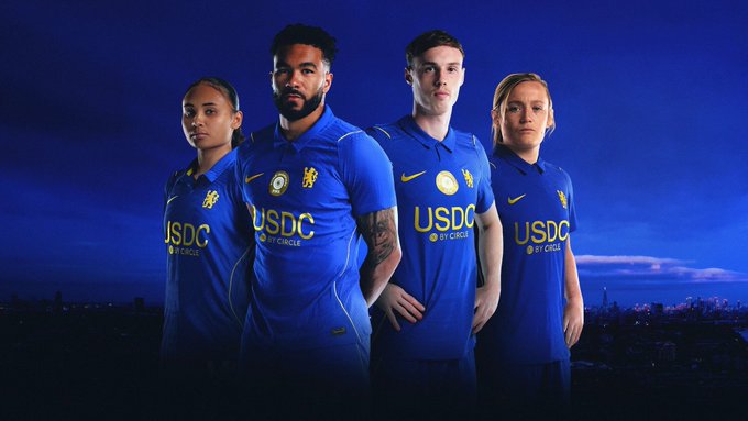 Four soccer players model blue jerseys prominently featuring "USDC by Circle" sponsorship alongside the Chelsea FC crest, visually promoting the cryptocurrency stablecoin featured in the post's staking program announcement with APY rates ranging from 22.4% to 62.6%.