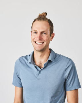 A smiling man with a man bun and a blue polo shirt poses for a professional headshot against a light background. The image likely depicts Sam Blackshear, the Mysten Labs CTO mentioned in the post, who is transitioning to a defensive security research role at Anthropic.