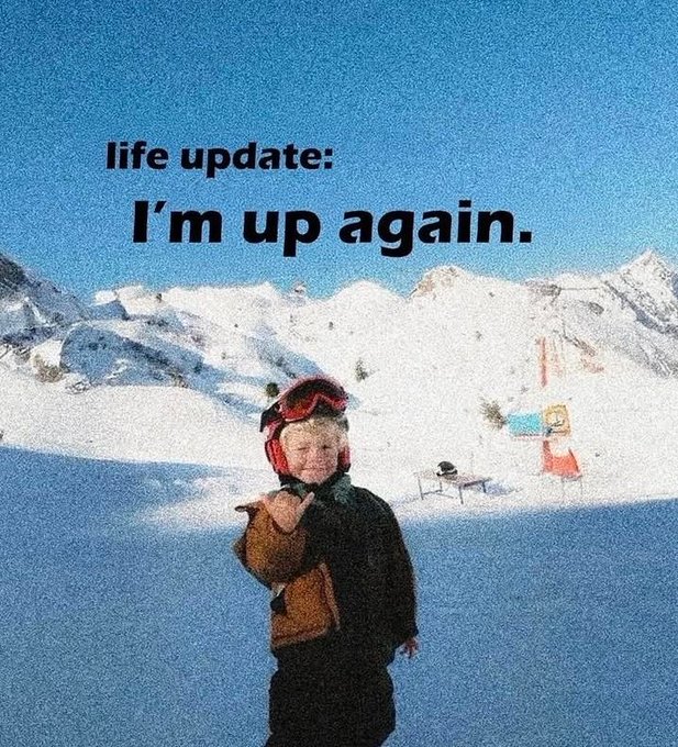 Motivational photo of a smiling child in ski gear on a snowy mountain with the text 'life update: I'm up again.'