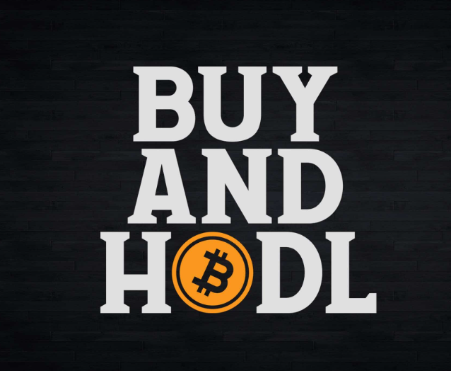 Bold white text reading "BUY AND HOLD" against a dark wood background, with the "O" creatively replaced by an orange Bitcoin logo, reinforcing the post's message that long-term HODLing outweighs short-term trading since most of Bitcoin's annual gains occur in just a few days.