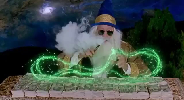 The image features a man dressed as a wizard sitting at a table with piles of money around him, including a large stack of dollar bills that appear to be in various stages of handling - some have been folded or creased while others are still standing upright. The scene also includes smoke coming from the money, giving it an otherworldly appearance, and a green glow near the top center of the image suggests magic or energy is involved. A caption on this image reads "How it feels to make a sol on the first trade of the day in this market", implying that the wizard's work involves magic or other mystical forces related to financial transactions.