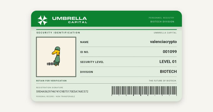 A digital ID card for 'Umbrella Capital' featuring a cartoon duck avatar, with the name 'valenciacrypto', ID No. '001099', and Security Level 'LEVEL 01' in the Biotech division.