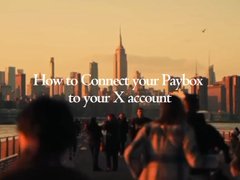 A photograph of people looking out at a city skyline with the overlaid text "How to Connect your Paybox to your X account".