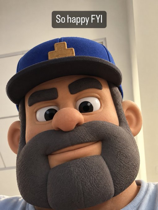 A close-up of a 3D cartoon character with a large gray beard wearing a blue cap, with a caption reading 'So happy FYI' at the top.