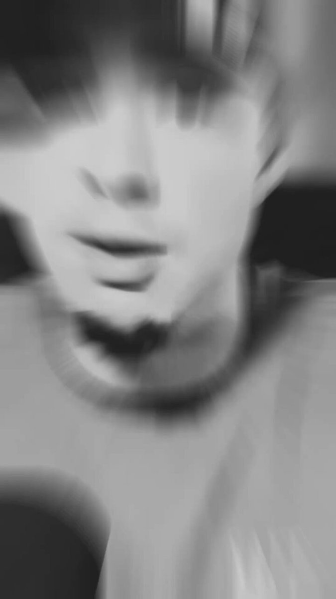 The focus of the image appears to be a blurred close-up photo of someone's face, possibly their neck or shoulders area. The surrounding environment includes text discussing recent price movements, specifically Bitcoin and XRP, which indicates that this might be related to currency fluctuations. There is no visible interaction between the person in the photo and the post, so it seems like an advertisement or announcement about cryptocurrency prices at a specific time.