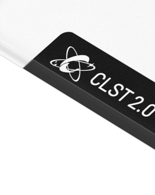 A sleek black hockey stick blade displays a white atom-like logo alongside the text "CLST 2.0," with the textured grip and angular framing reinforcing the brand's sleek, performance-driven identity hinted at in the "NEXT SURFACE. NEXT MOVE." tagline.