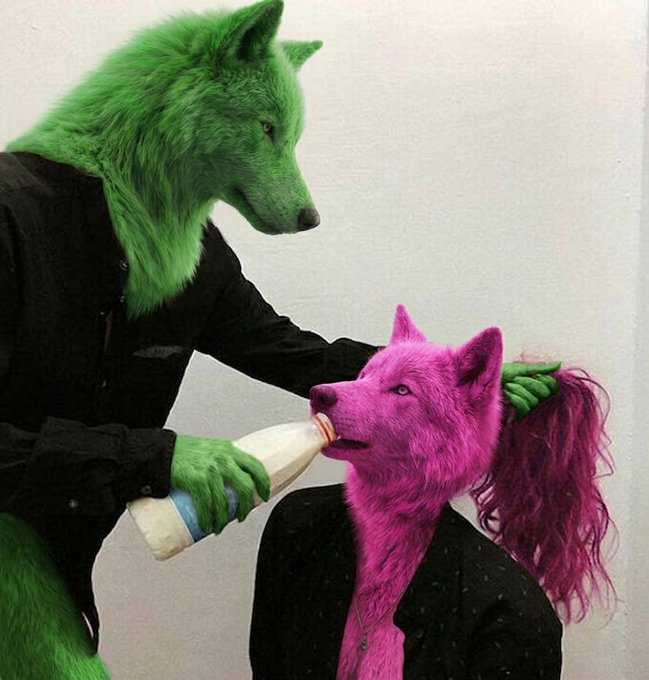 An artistic photo featuring two anthropomorphic figures: a green wolf wearing a black shirt feeding a baby bottle to a smaller pink wolf cub, who has a long pink ponytail and wears a black jacket.