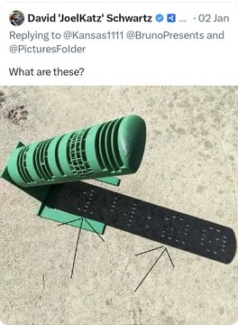 A green and black chainsaw-style object is shown resting on sand, appearing in response to a social media post tagged #XRP, likely used as visual satire or commentary rather than depicting any actual product. The tweet is from David 'JoelKatz' Schwartz dated 02 Jan, asking "What are these?" while replying to @Kansas1111, @BrunoPresents and @PicturesFolder.