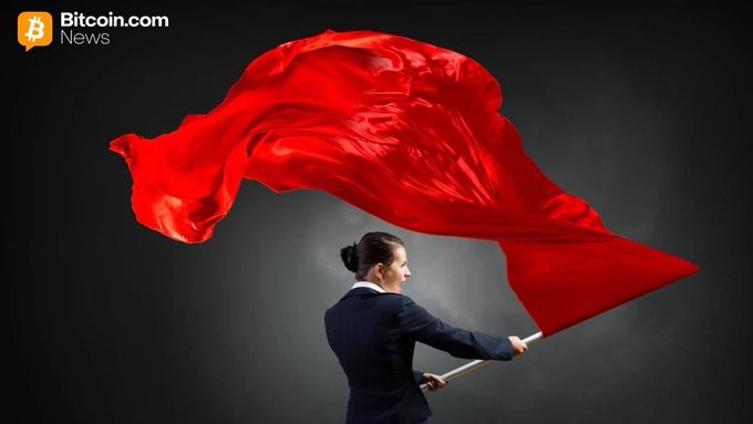A conceptual image from Bitcoin.com News showing a woman in a suit holding a large, billowing red flag against a dark background.