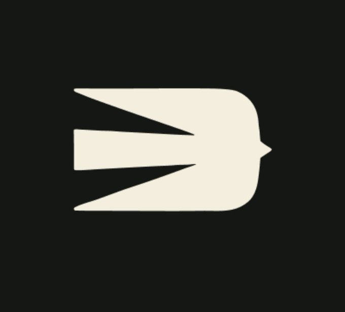A minimalist white logo on a dark gray background resembling a stylized profile or bird.
