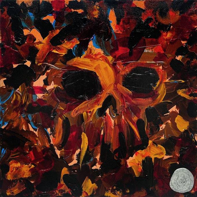 An abstract expressionist painting featuring a chaotic composition of black, orange, red, and brown brushstrokes that form a skull-like shape, with a silver circular emblem in the bottom right corner.