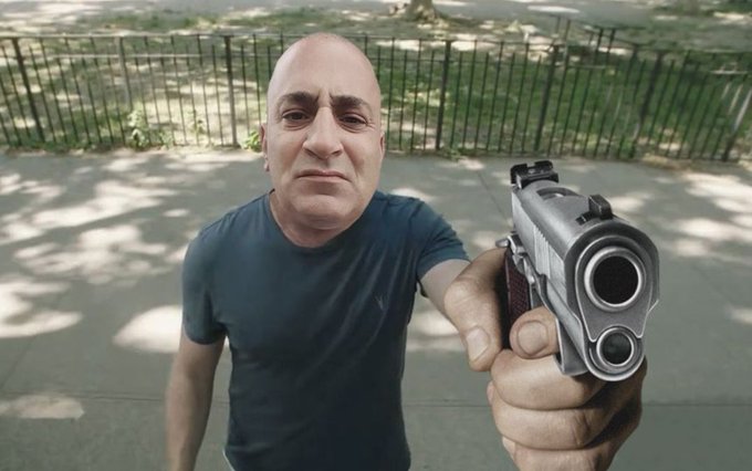 The image shows a man holding a gun, possibly posing for a photo or video. There are also some text elements in the image that read "focus on what is in the image" and "$ALGO I have nothing to do with this pump." These texts seem unrelated to the main subject of the image - the man holding the gun. The focus should be on the man, his actions, or the context surrounding him rather than the gun he's holding.