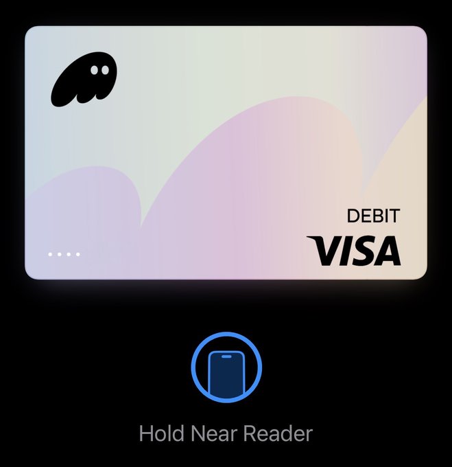 A digital debit Visa card with a pastel gradient design and ghost-like logo is displayed on a mobile payment screen prompting "Hold Near Reader," illustrating the user's recent contactless purchases made with Phantom Cash.