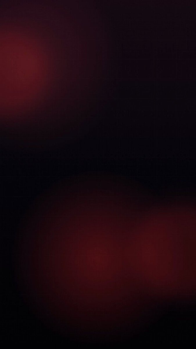 The image shows a dark background, which appears blurry due to the lack of light or focus. There are two red circles floating around the center of the frame, creating an interesting visual effect. The blurred background suggests that the viewer's attention has been drawn towards these circles. The caption "We are already preparing the library with resources so you can help promote Hive" is located at the bottom right corner of the image, providing context to the scene and possibly indicating a connection between the blurry background and the promotion of the library or resources available on it.