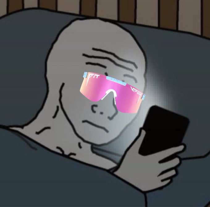 The image features a man wearing pink sunglasses while sitting in bed, looking at his cell phone. He appears to be reading something on his phone or engaging with an app. The text above him reads "While others are letting emotions dictate their decisions, the smart money is focused on positioning themselves for position. Market uncertainty creates opportunity for those with conviction. Already made my choice and continue to build my position in WOJAK. The risk/reward looks too attractive to". This post seems to be discussing investing strategies or market trends, as it suggests that the man's decision-making process is influenced by financial analysis rather than emotions.