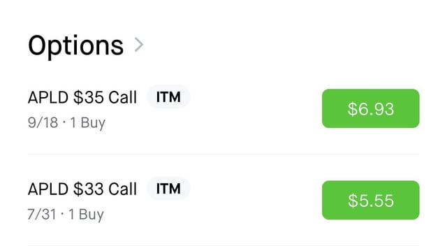 The image shows an options trading screen displaying two call options for $APLD: a $35 Call expiring 9/18 priced at $6.93 and a $33 Call expiring 7/31 priced at $5.55, both marked as ITM (in the money). This directly relates to the post as it reveals the specific call options the user is watching on Applied Digital ($APLD).