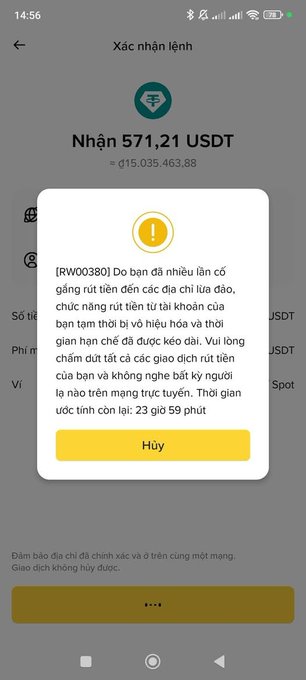 A smartphone screenshot of a Vietnamese crypto wallet interface displaying a confirmation dialog box for receiving 571.21 USDT, with a warning message in Vietnamese about the transaction.