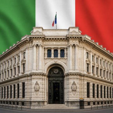 The image shows the Bank of Italy's headquarters building with the Italian flag waving above it and the inscription "BANCO D'ITALIA" visible on the facade. This relates to the post as it depicts the very institution that conducted the real-world stress test on stablecoin remittances across the 10 global corridors mentioned.