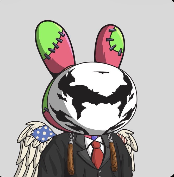 A cartoon-style illustration of a character with a spherical white head featuring black mask-like patterns, wearing pink and green stitched rabbit ears, a black suit with a red tie, and white angel wings.