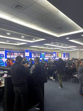 The image shows a crowded conference or trade show floor with attendees networking in front of large displays and screens showing charts and data. A banner referencing "Zcash Brazil" ties the scene to the post about Dash making an appearance at an event in Brazil alongside the Zcash Brazil community.