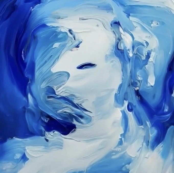 An abstract painting featuring swirling blue and white brushstrokes that suggest a face or figure emerging from the colors.