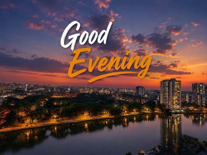 A scenic evening cityscape featuring a lake reflecting the colorful sunset sky and city lights, overlaid with the stylized text 'Good Evening'.