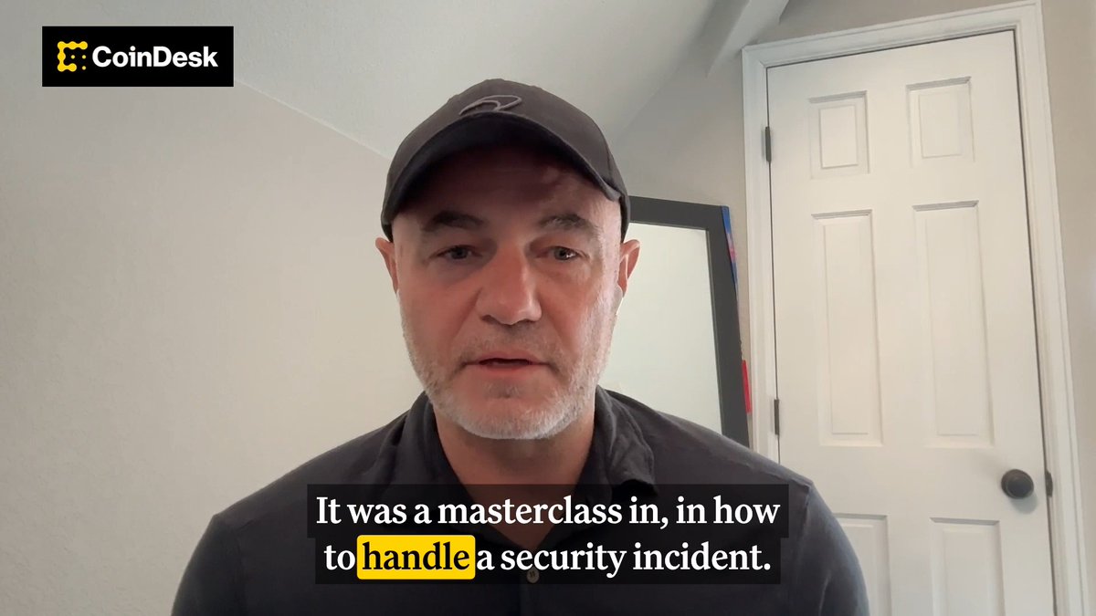 The image shows a man wearing a black baseball cap standing against a white wall with a door nearby. The man appears to be talking about security incidents or a bug that crashed ZEC, which has led him to call for a masterclass on handling such situations. He emphasizes the importance of tight security processes and rigorous audits in order to prevent future incidents.