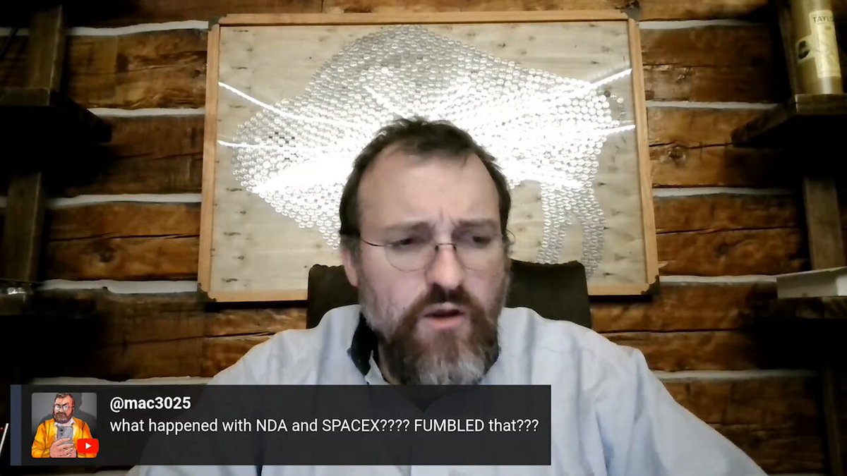 The image shows an image of a man wearing glasses sitting at a desk. The caption below his photo explains that he was discussing SPCX with SpaceX founder Charles Hoskinson during a talk. He mentions his interest in the emerging field of quantum communication, particularly for Starlink, which is a satellite-based internet service. However, there are no specific details about what happened during their conversation or if any plans were made to upgrade Starlink to accommodate Quantum Cryptography at that time.