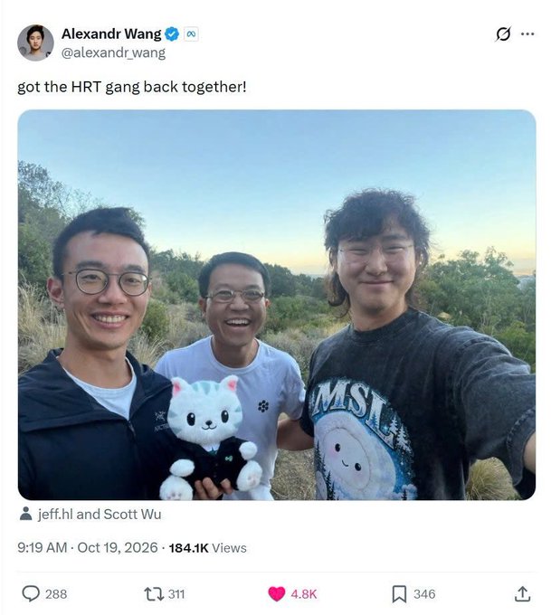 A screenshot of a tweet by Alexandr Wang (@alexandr_wang) dated October 19, 2026, captioned 'got the HRT gang back together!' showing a selfie of three smiling young men outdoors, with the middle person holding a white alpaca plushie.