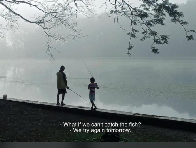 A misty, atmospheric scene shows two people fishing by a fog-covered lake, with white text overlay reading '- What if we can't catch the fish? - We try again tomorrow.'
