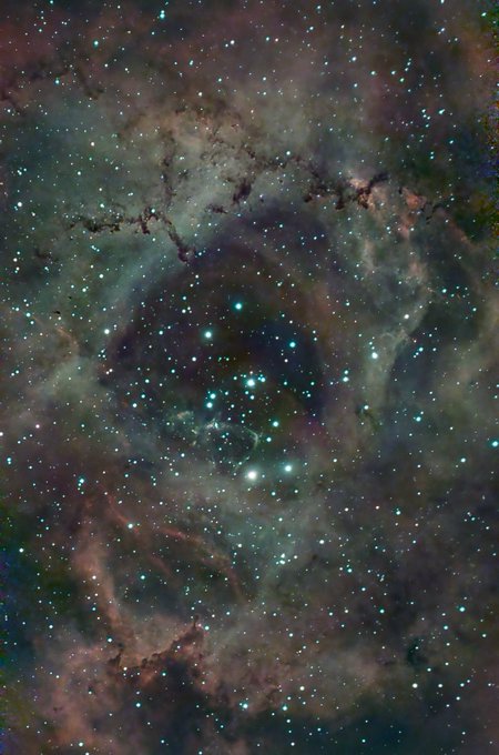 A glowing nebula filled with bright stars and cosmic dust clouds, evoking the mystical "Heart of the Rose" referenced in the post. The swirling celestial patterns and radiant starlight create a romantic, otherworldly scene fitting the poetic #Tezos message.