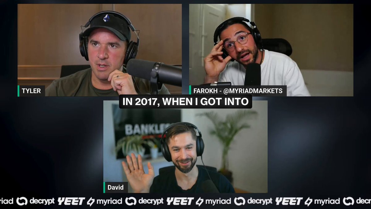 The image shows a group of three men wearing headphones, with one man holding up his hand as if he's giving directions or making a gesture. The background features a computer screen displaying a podcast recording from 2017, which includes text such as "In 2017 when I got into" and "@APompliano was spouting the same garbage about the time he was selling Bitcoin Pizzas".