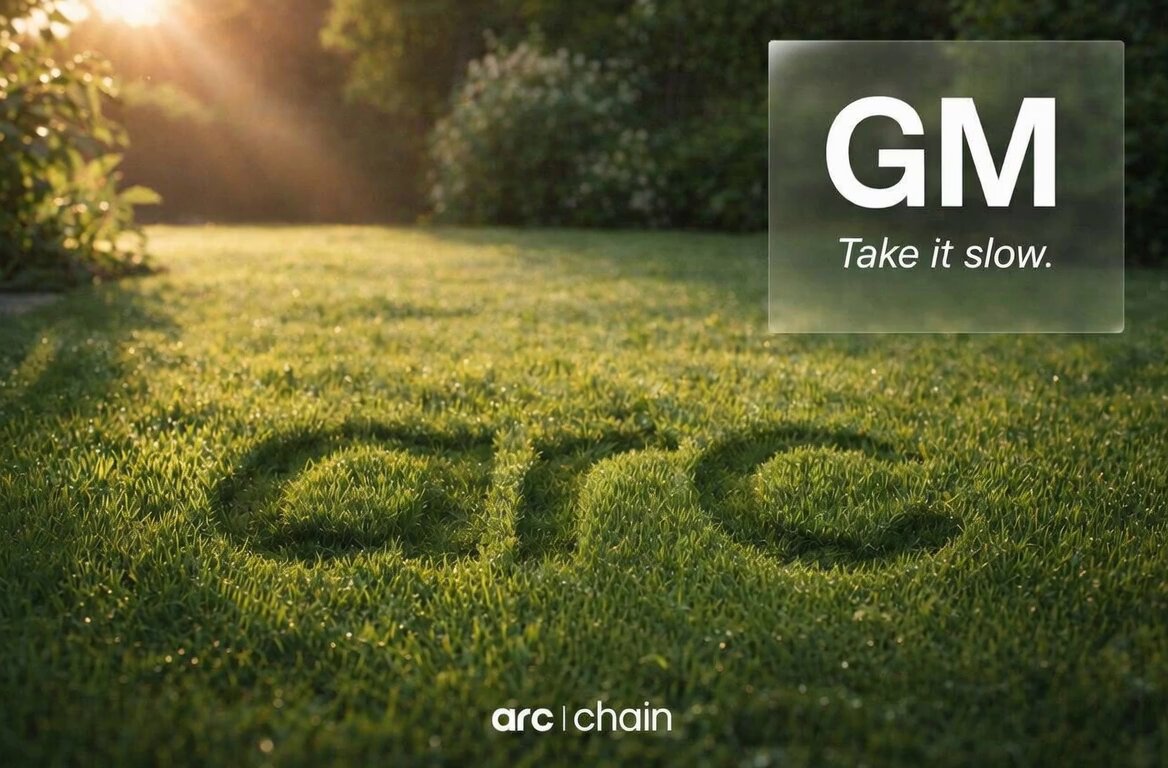 The image features a green lawn with the word "gm" written on it, which appears to be made out of grass. The background of the image shows trees and bushes, creating an outdoor setting. Below the grassy area, there's text that reads "Take It Slow." This message is accompanied by a photo of a person sitting in front of a computer screen with the words "arc chain" written on it.