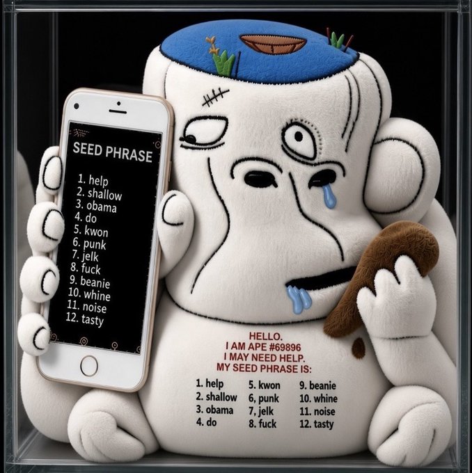 A plush toy resembling a sad, stitched-together ape with a hole in its head, holding a smartphone displaying a 'SEED PHRASE' list and a brown object, with a printed list of words on its belly.