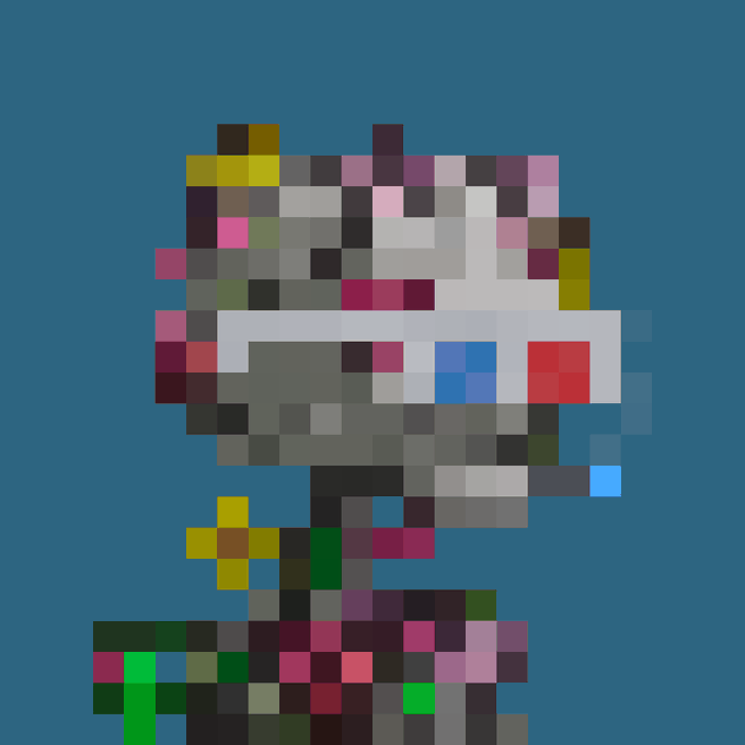 A pixelated, low-resolution image shows a figure with colorful blocks against a dark blue background.