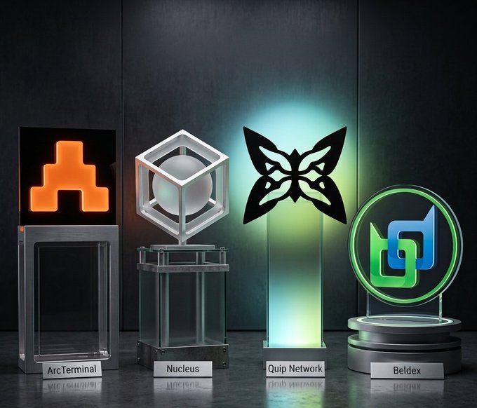 Four illuminated cryptocurrency or blockchain trophies are displayed on pedestals against a dark background, labeled 'ArcTerminal', 'Nucleus', 'Quip Network', and 'Beldex', each featuring a distinct glowing logo.