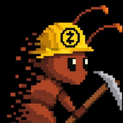 Pixel art of a red ant wearing a yellow construction hard hat with a 'Z' logo, holding a pickaxe.
