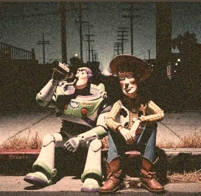 An artistic image with a vintage filter depicting Buzz Lightyear and Woody from Toy Story sitting on a curb in a desolate urban setting at night, with the word 'Trust' faintly visible.