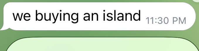 Text message screenshot showing a green chat bubble that reads 'we buying an island' sent at 11:30 PM.