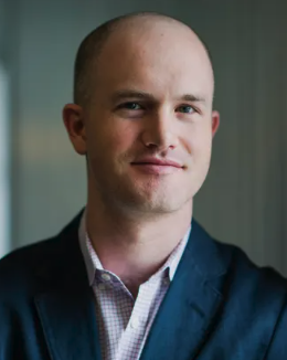A headshot of a smiling, bald man in a dark blazer and patterned shirt. The image accompanies a post about Coinbase CEO Brian Armstrong's bold prediction that Bitcoin will reach $300,000–$400,000 by 2030.