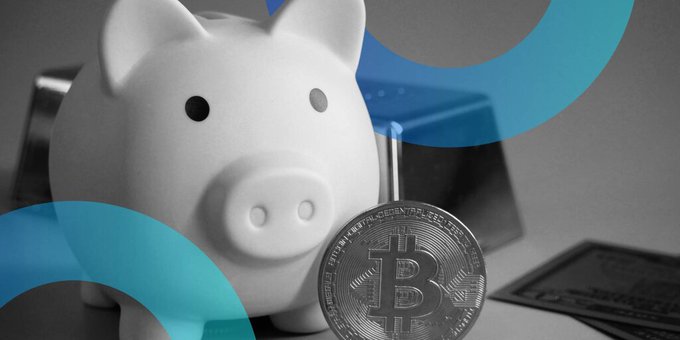 A conceptual image showing a white piggy bank next to a physical Bitcoin token with a Bitcoin logo overlay, suggesting cryptocurrency savings or finance.