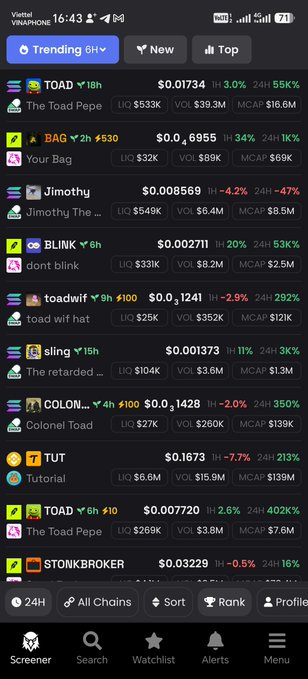 A cryptocurrency tracker app (Yuhu VNAPhone) displaying trending tokens including TOAD at $0.01734 (+3.0%), BAG ($0.0), Jimothy ($0.008569), BLINK ($0.002711), toadwif ($0.01241), sling ($0.001373), COLON ($0.012428), TUT ($0.1673), and STONKBROKER ($0.03229).