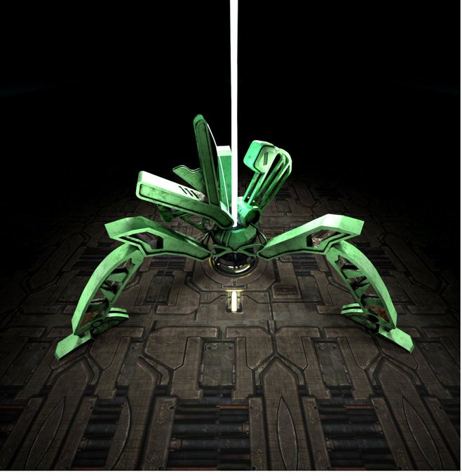 A green mechanical spider-like robot with multiple legs sits on a dark metallic floor, illuminated by a vertical light beam.