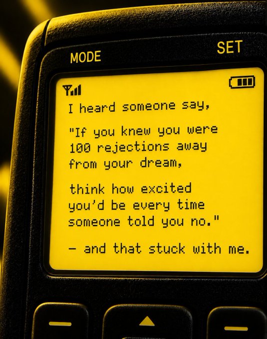 A close-up of an old mobile phone displays a motivational text on its yellow screen: "I heard someone say, 'If you knew you were 100 rejections away from your dream, think how excited you'd be every time someone told you no.' – and that stuck with me."

The image pairs with the post "Yep..." to convey quiet agreement with the message about finding gratitude in rejection, framing each "no" as one step closer to success.