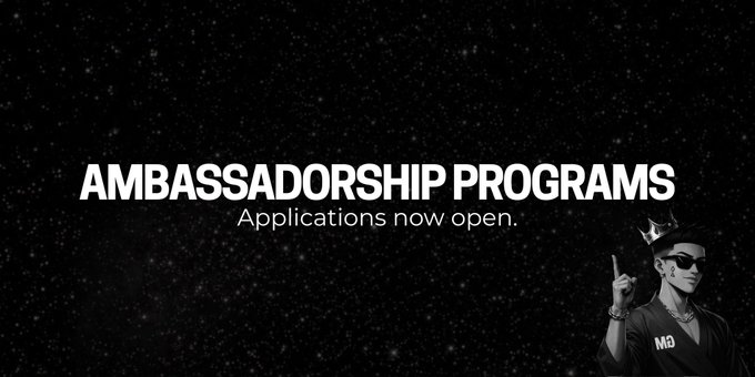 "AMBASSADORSHIP PROGRAMS – Applications now open" is displayed in bold white text against a black starry background, featuring a stylized figure wearing a crown, sunglasses, and an "M3" branded shirt in the bottom right corner.

The image ties directly to the post by highlighting a batch of six open ambassadorship opportunities, where applicants can earn up to $300+ per month in USDT or tokens.