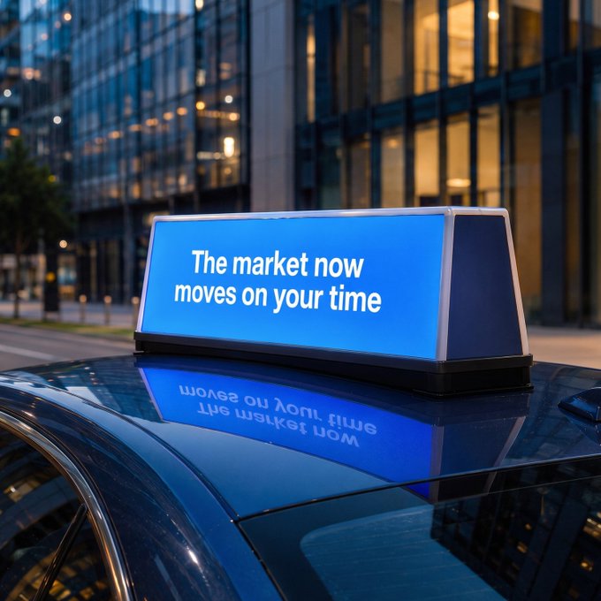 A glowing blue rooftop taxi-top display reads "The market now moves on your time," parked in front of a modern glass office tower at dusk. The illuminated ad mirrors the post's message of round-the-clock trading freedom, visually reinforcing the idea that financial access no longer follows traditional Wall Street hours.