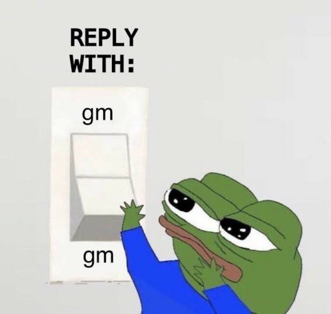 A meme featuring the Sad Pepe frog character pointing to an elevator button panel labeled 'gm' on both buttons, with text reading 'REPLY WITH:' above.