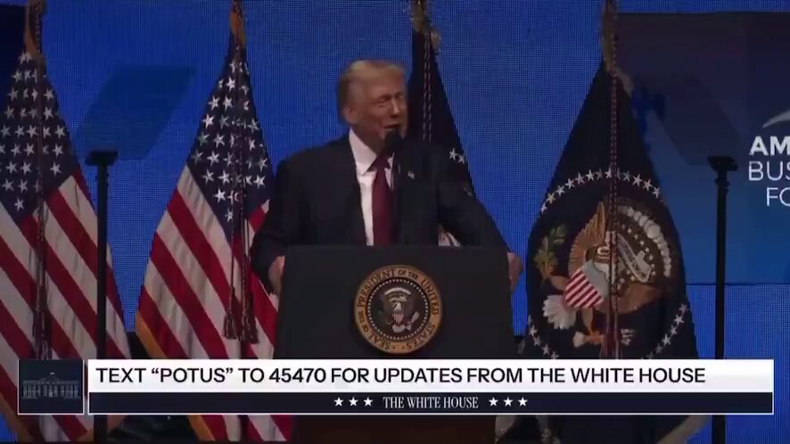 The image features a man standing at a podium with his hands on a podium, giving a speech or presentation. The backdrop of the scene includes several American flags, which suggests that this event might be taking place in an official setting such as a government building or a public gathering. The text "Text 'potus' to 44970 for updates from the white house" is visible in the image, indicating that there could be a discussion about Bitcoin and its impact on the economy or financial markets.